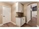 Hallway with built-in cabinets and wood floors at 4213 E Stanford Ave, Gilbert, AZ 85234