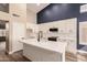 Modern kitchen with white cabinets and quartz countertops at 4213 E Stanford Ave, Gilbert, AZ 85234