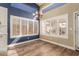 Kitchen with white cabinets, an island and wood-look floors at 4213 E Stanford Ave, Gilbert, AZ 85234