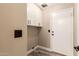 Laundry room with white cabinets and wood floors at 4213 E Stanford Ave, Gilbert, AZ 85234