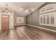 Living room with wood-look floors and vaulted ceiling at 4213 E Stanford Ave, Gilbert, AZ 85234