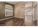 Open living space showcasing wood floors and an accent wall at 4213 E Stanford Ave, Gilbert, AZ 85234