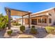 Patio with pergola cover and stone flooring at 4213 E Stanford Ave, Gilbert, AZ 85234