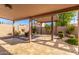 Covered patio with stone flooring and landscaping at 4213 E Stanford Ave, Gilbert, AZ 85234