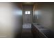 Bathroom with tub and custom vanity featuring unique finishes at 431 W Rough Rider Rd, New River, AZ 85087