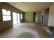 Bright living room with sliding glass doors to backyard at 431 W Rough Rider Rd, New River, AZ 85087