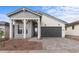 Well-maintained single-story home with neutral tones, accented by a stylish entry and garage door at 4412 N 203Rd Dr, Buckeye, AZ 85396