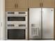 Stainless steel appliances including double oven and french door refrigerator at 4412 N 203Rd Dr, Buckeye, AZ 85396