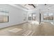 Bright, open living room featuring recessed lighting, many windows, and beautiful tile floors at 4412 N 203Rd Dr, Buckeye, AZ 85396