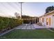 Relaxing backyard patio with fire pit and string lights at 4841 E Amelia Ave, Phoenix, AZ 85018