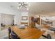 Open concept dining room with mid-century modern style table and light-filled space at 4841 E Amelia Ave, Phoenix, AZ 85018