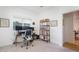 Bright home office features built-in shelving and window views at 4841 E Amelia Ave, Phoenix, AZ 85018