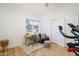 Home office with desk, chair, and exercise bike at 4841 E Amelia Ave, Phoenix, AZ 85018