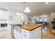 Modern kitchen island with farmhouse sink and stainless steel dishwasher at 4841 E Amelia Ave, Phoenix, AZ 85018