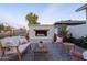 Outdoor patio with fireplace and comfortable seating at 4841 E Amelia Ave, Phoenix, AZ 85018