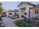 Outdoor patio with a fire pit, seating area, and beautiful landscaping at 4841 E Amelia Ave, Phoenix, AZ 85018