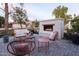 Relaxing outdoor patio with fire feature, modern seating, and greenery at 4841 E Amelia Ave, Phoenix, AZ 85018