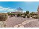 Backyard with gravel, stone pathway, and landscaping at 5077 S Barley Way, Gilbert, AZ 85298