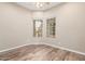 Bright bedroom with wood-look flooring and large windows at 5077 S Barley Way, Gilbert, AZ 85298