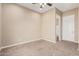 Bright bedroom with carpet flooring and access to bathroom at 5077 S Barley Way, Gilbert, AZ 85298