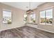 Dining area with built-in bench seating and large windows at 5077 S Barley Way, Gilbert, AZ 85298