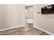 View down hallway to kitchen with wood-look floors at 5077 S Barley Way, Gilbert, AZ 85298