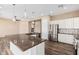 L-shaped kitchen with granite countertops and stainless steel appliances at 5077 S Barley Way, Gilbert, AZ 85298