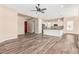 Open living area with wood-look tile flooring and ceiling fan at 5077 S Barley Way, Gilbert, AZ 85298