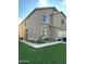 Two-story home featuring a neutral color scheme, attached garage, and a well-maintained artificial lawn at 5131 W Fairview St, Chandler, AZ 85226