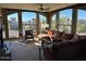 Spacious living room with large windows and sectional sofa at 5350 E Deer Valley Dr # 4248, Phoenix, AZ 85054