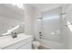 Bright and modern bathroom with a combination tub and shower and a large vanity with sink at 6383 W Georgetown Way, Florence, AZ 85132