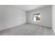 This bright bedroom features soft gray carpet and a large window for natural light at 6383 W Georgetown Way, Florence, AZ 85132