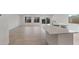 Open-concept kitchen featuring granite counters, a breakfast bar, and access to the back patio at 6383 W Georgetown Way, Florence, AZ 85132