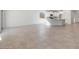 Open living area features tile flooring, ample natural light, and kitchen access, perfect for modern living and entertaining at 6383 W Georgetown Way, Florence, AZ 85132