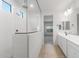 Modern bathroom featuring a walk-in shower with glass enclosure, and a large double sink vanity at 6383 W Georgetown Way, Florence, AZ 85132
