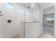 Bright bathroom featuring a walk-in shower with a glass enclosure and modern fixtures at 6383 W Georgetown Way, Florence, AZ 85132