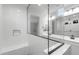 A clear glass enclosed walk in shower with a large vanity with double sinks is featured in this bath at 6383 W Georgetown Way, Florence, AZ 85132
