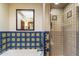 Bathroom showing tub and shower with colorful tiling and glass door at 7500 E Mccormick Pkwy # 19, Scottsdale, AZ 85258