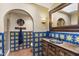 Unique bathroom with colorful tiling, arched doorway, and detailed vanity at 7500 E Mccormick Pkwy # 19, Scottsdale, AZ 85258