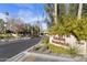 Community entrance sign, Colonia Encantada, set amidst trees and desert landscaping at 7500 E Mccormick Pkwy # 19, Scottsdale, AZ 85258