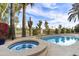 Sparkling pool and hot tub surrounded by lush landscaping, creating a serene backyard retreat at 7500 E Mccormick Pkwy # 19, Scottsdale, AZ 85258