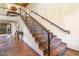 Staircase with wrought iron banister and patterned tile risers at 7500 E Mccormick Pkwy # 19, Scottsdale, AZ 85258