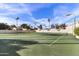 Bright tennis court ready for a friendly match with well-maintained surface and clear skies at 7500 E Mccormick Pkwy # 19, Scottsdale, AZ 85258