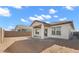 Home exterior featuring a covered patio and spacious backyard at 7548 W Park St, Laveen, AZ 85339