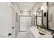 Bathroom with double vanity, shower, and tiled floor at 7548 W Park St, Laveen, AZ 85339