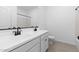 Bathroom features double sinks, white cabinets and countertops, and tiled floors at 7548 W Park St, Laveen, AZ 85339