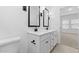 Bright bathroom boasts dual sinks, modern fixtures, and a sleek, minimalist design at 7548 W Park St, Laveen, AZ 85339