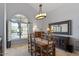 Elegant dining room with a rustic wooden table and chandelier at 8028 E La Junta Rd, Scottsdale, AZ 85255