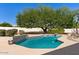 Inviting kidney-shaped pool with large shade tree at 8028 E La Junta Rd, Scottsdale, AZ 85255