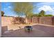 Spacious backyard with fire pit and brick wall at 8344 E Indianola Ave, Scottsdale, AZ 85251